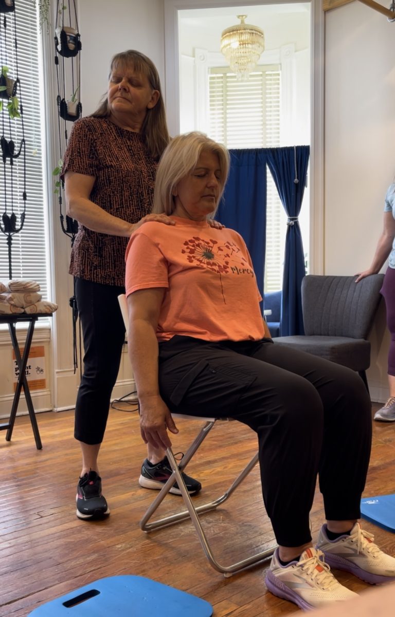 Lady getting an Indian Head Massage.