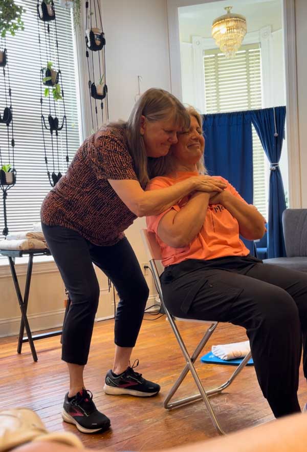 Lady getting an Indian Head Massage.